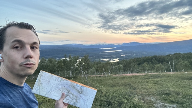 Reading the landscape and posing with the map.
