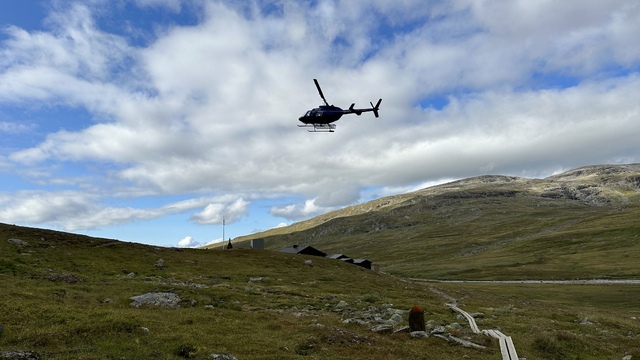 A helicopter dropped some lazy people off.
